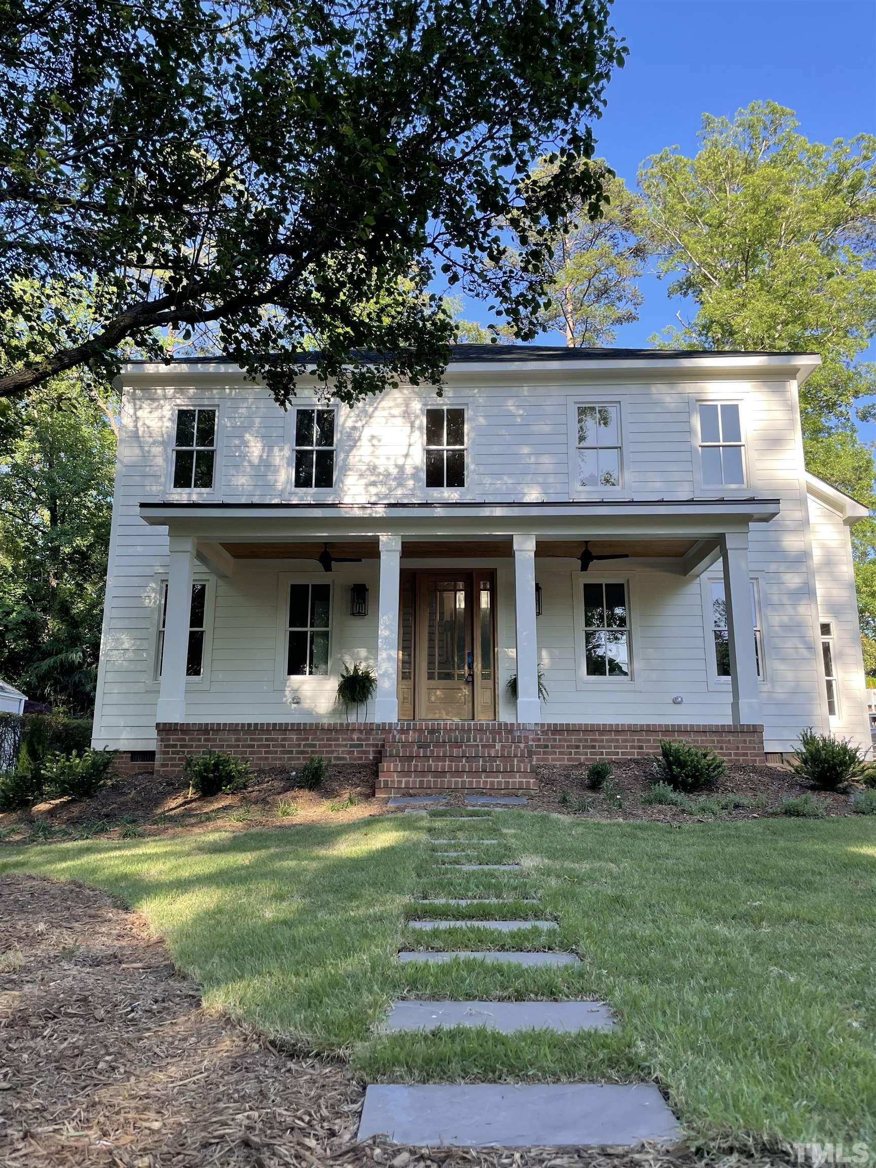 1500 Banbury Road Raleigh, NC 27607 - Photo 1 of 39 a front view of a house with garden