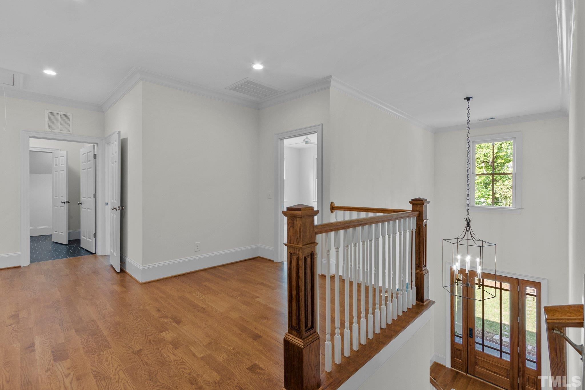 1500 Banbury Road Raleigh, NC 27607 - Photo 17 of 39 a view of a hallway with entryway and stairs