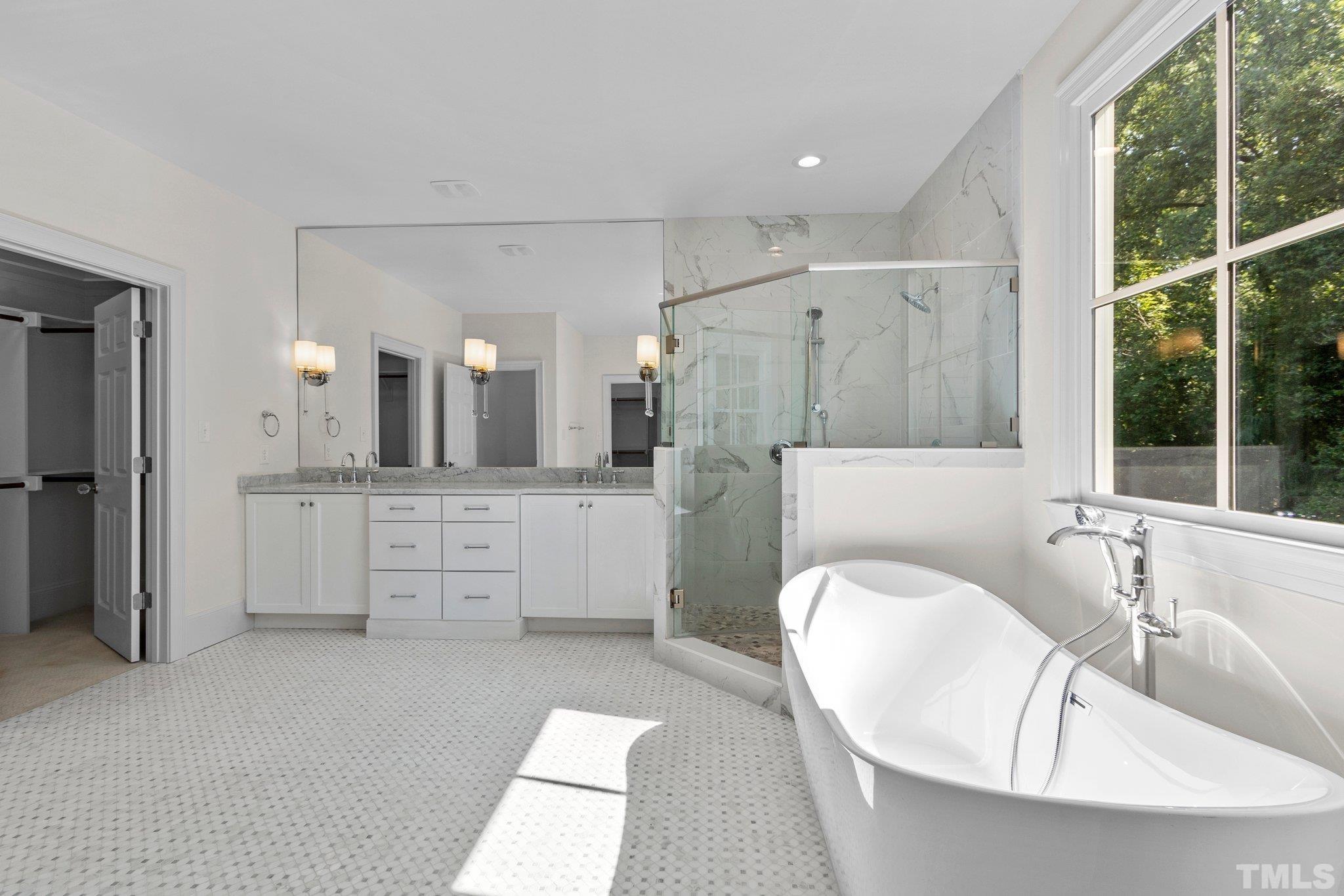 1500 Banbury Road Raleigh, NC 27607 - Photo 19 of 39 a bathroom with a granite countertop sink mirror and a bathtub