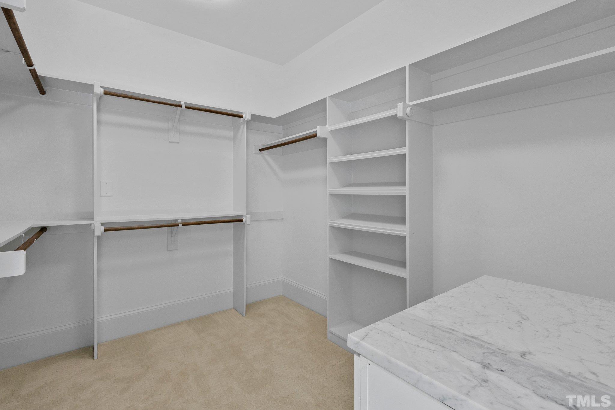 1500 Banbury Road Raleigh, NC 27607 - Photo 21 of 39 a room with closet and wooden shelves