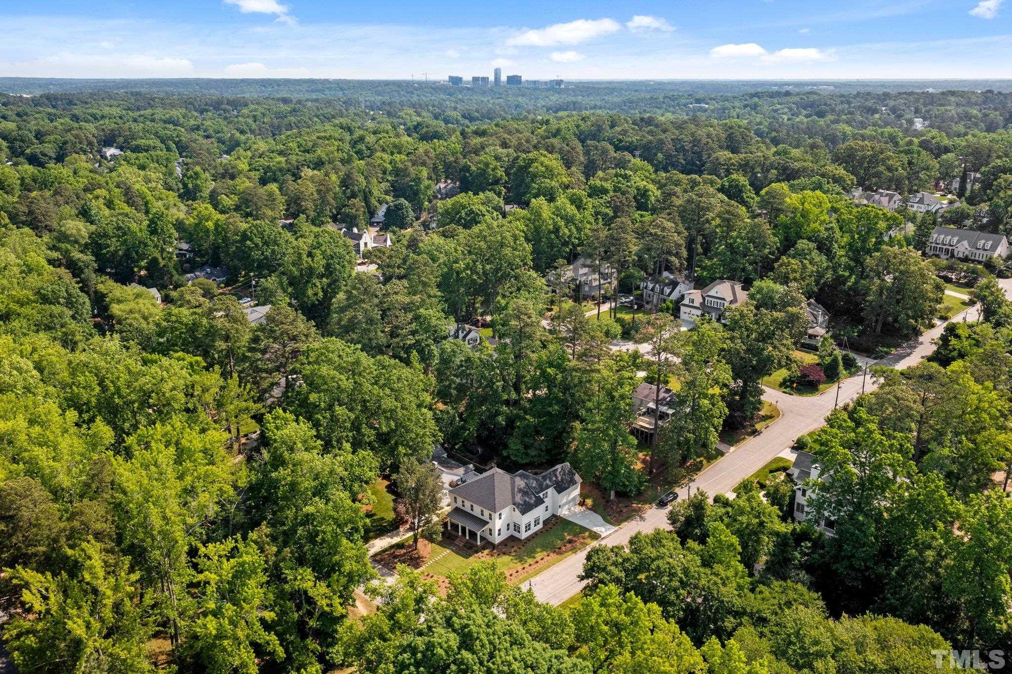 1500 Banbury Road Raleigh, NC 27607 - Photo 34 of 39 a view of a city with lush green forest