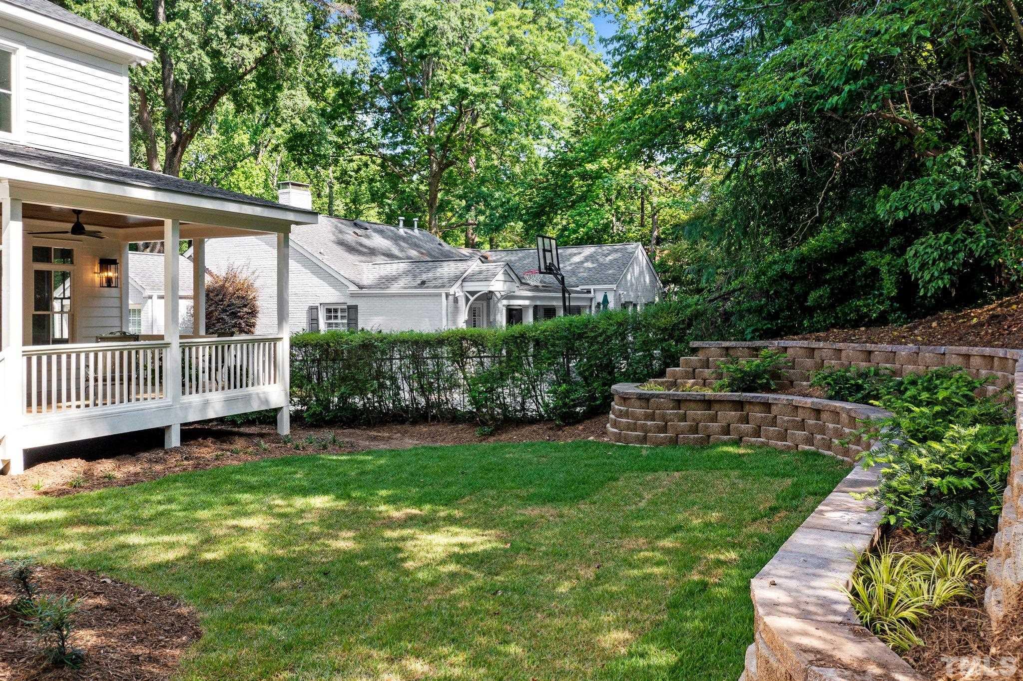 1500 Banbury Road Raleigh, NC 27607 - Photo 39 of 39 a view of a house with a backyard and a deck