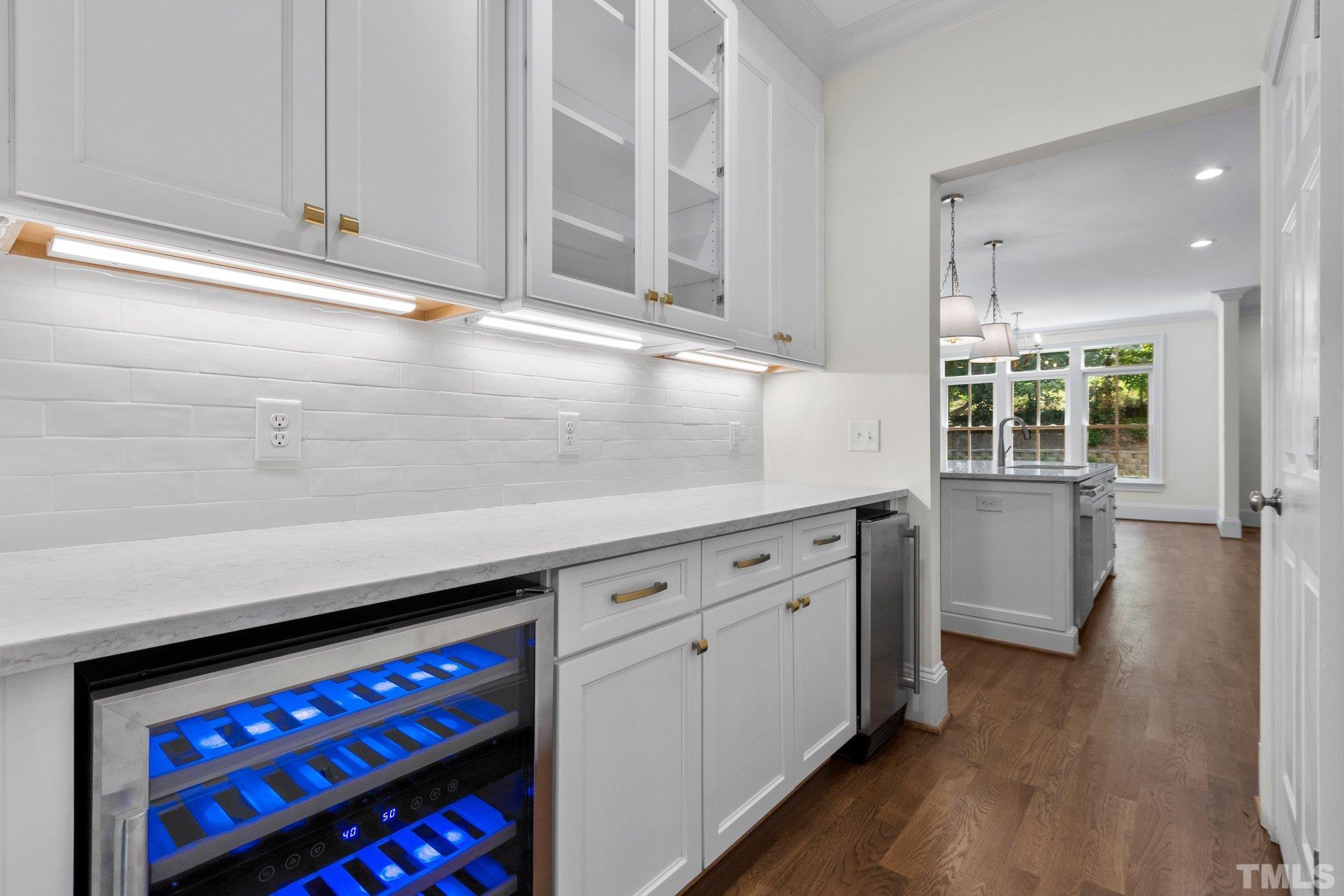 1500 Banbury Road Raleigh, NC 27607 - Photo 8 of 39 a kitchen with stainless steel appliances a cabinets and wooden floor