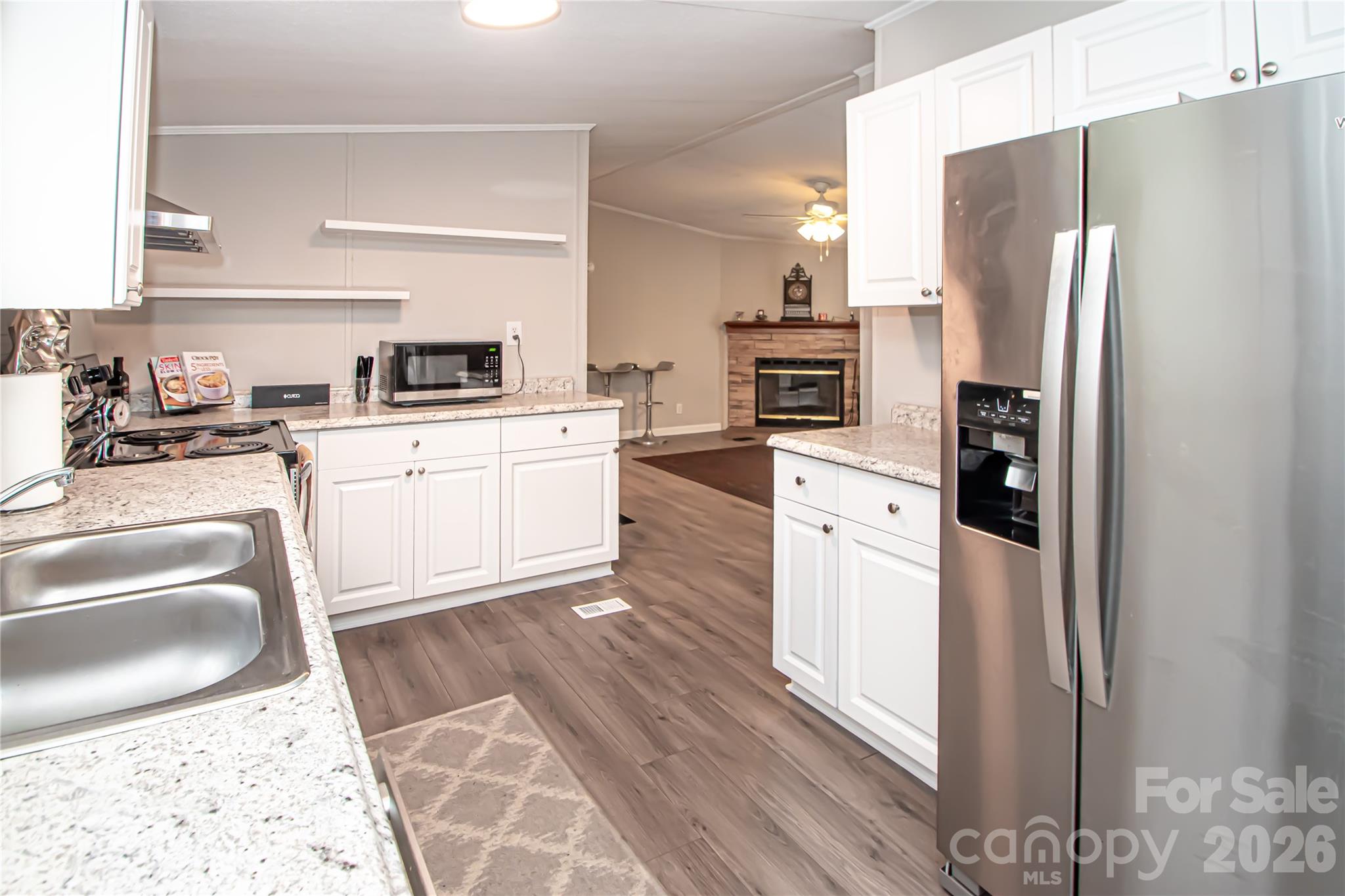 2345 Kingsburry Road York, SC 29745 - Photo 20 of 43 a kitchen with stainless steel appliances granite countertop a refrigerator sink and stove
