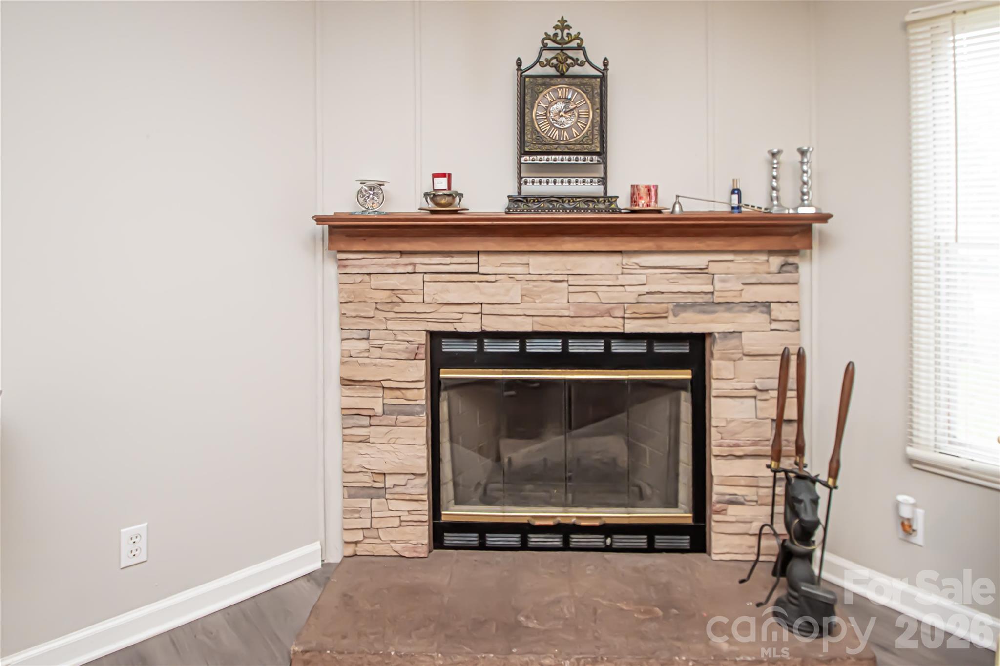 2345 Kingsburry Road York, SC 29745 - Photo 24 of 43 a living room with a fireplace and a window
