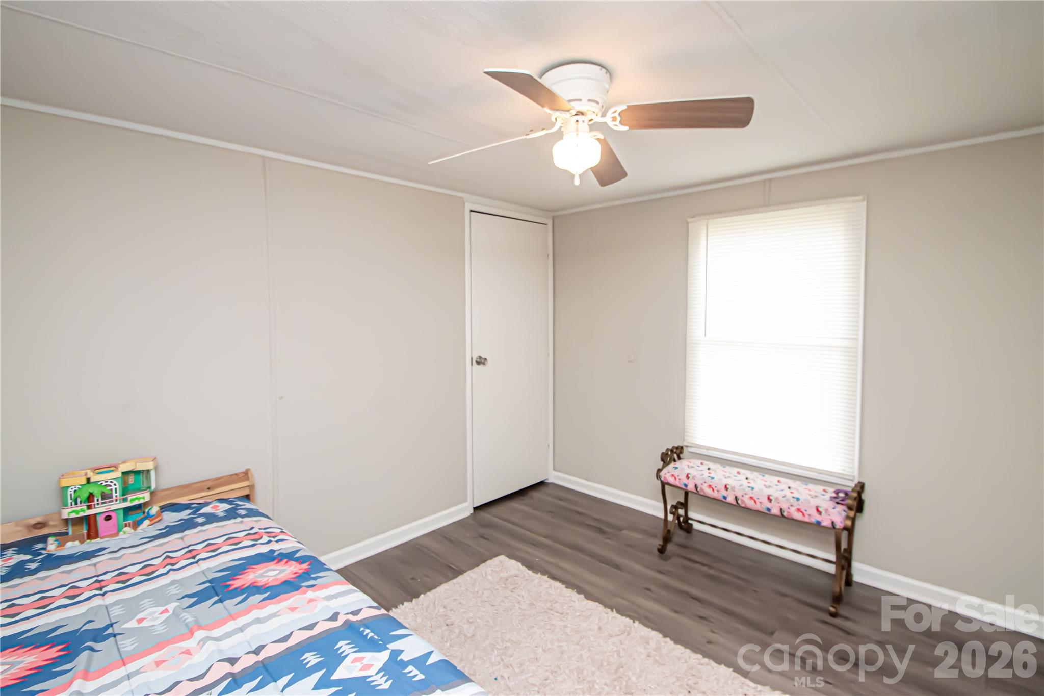 2345 Kingsburry Road York, SC 29745 - Photo 30 of 43 a bedroom with a bed and a chandelier