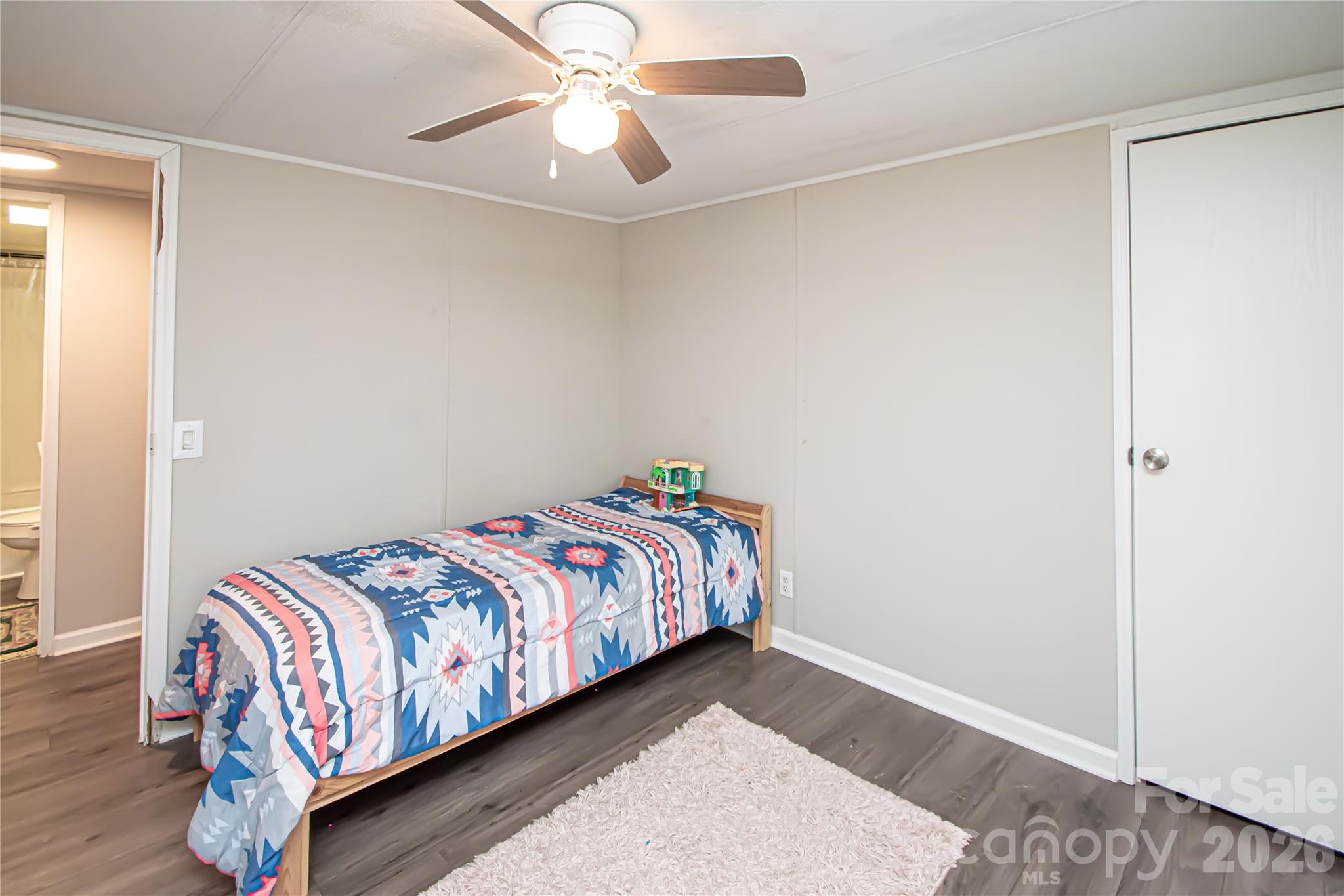 2345 Kingsburry Road York, SC 29745 - Photo 31 of 43 a bedroom with a bed and a chandelier