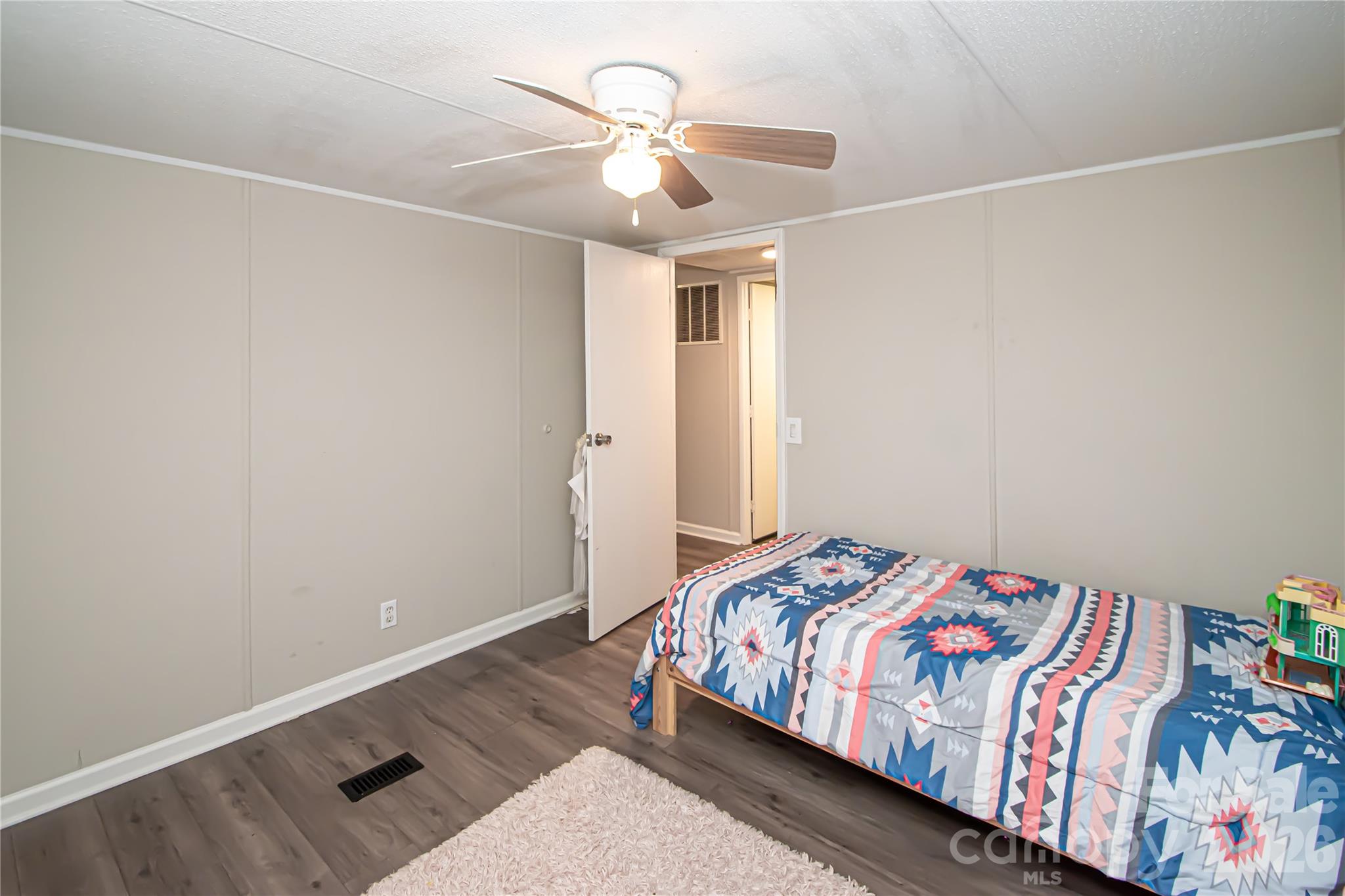 2345 Kingsburry Road York, SC 29745 - Photo 32 of 43 a bedroom with a bed and a chandelier