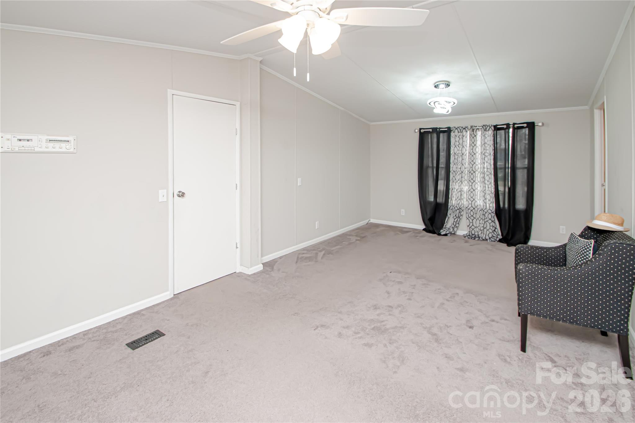 2345 Kingsburry Road York, SC 29745 - Photo 39 of 43 an empty room with windows and ceiling fan
