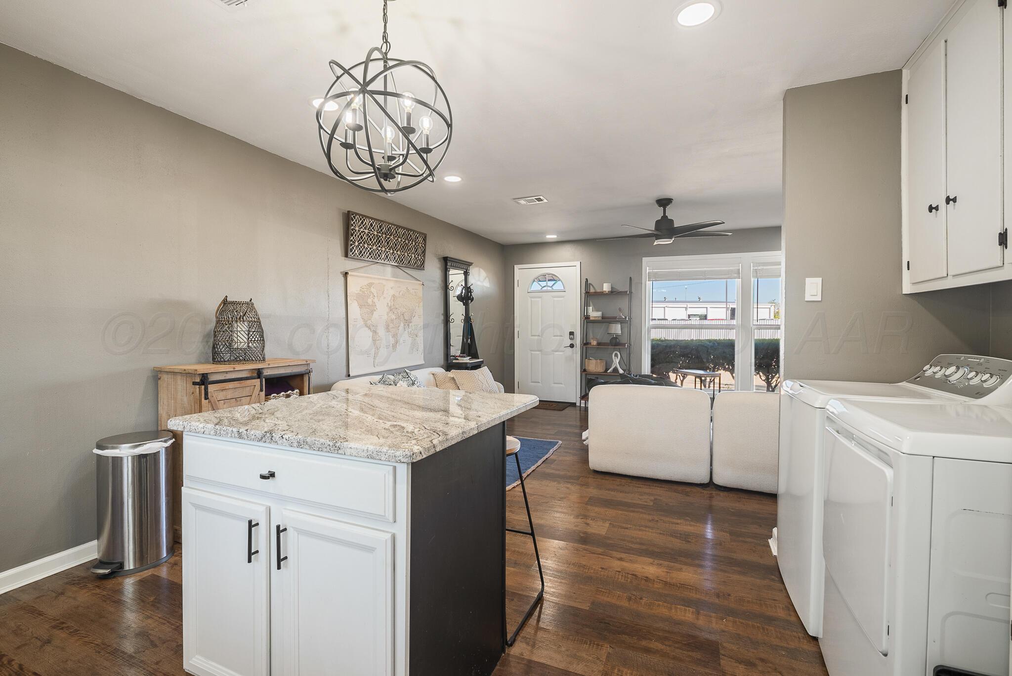 2220 Southeast 19th Avenue Amarillo, TX 79103 - Photo 12 of 25 a kitchen that has a lot of cabinets in it