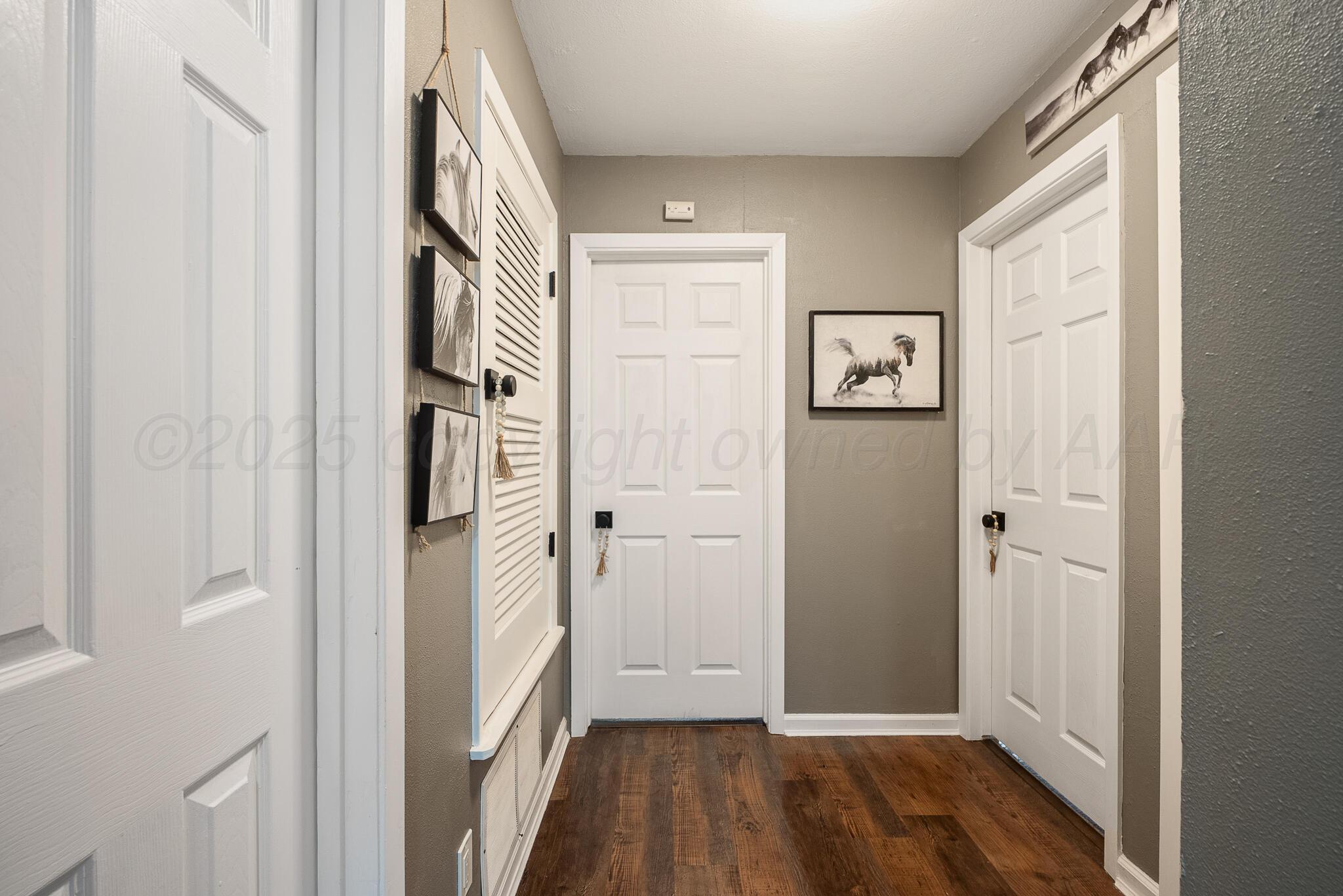 2220 Southeast 19th Avenue Amarillo, TX 79103 - Photo 13 of 25 a view of a hallway with wooden floor and entryway