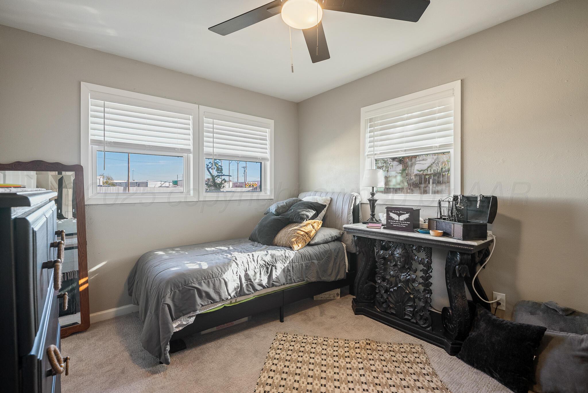 2220 Southeast 19th Avenue Amarillo, TX 79103 - Photo 18 of 25 a bedroom with a bed and a window