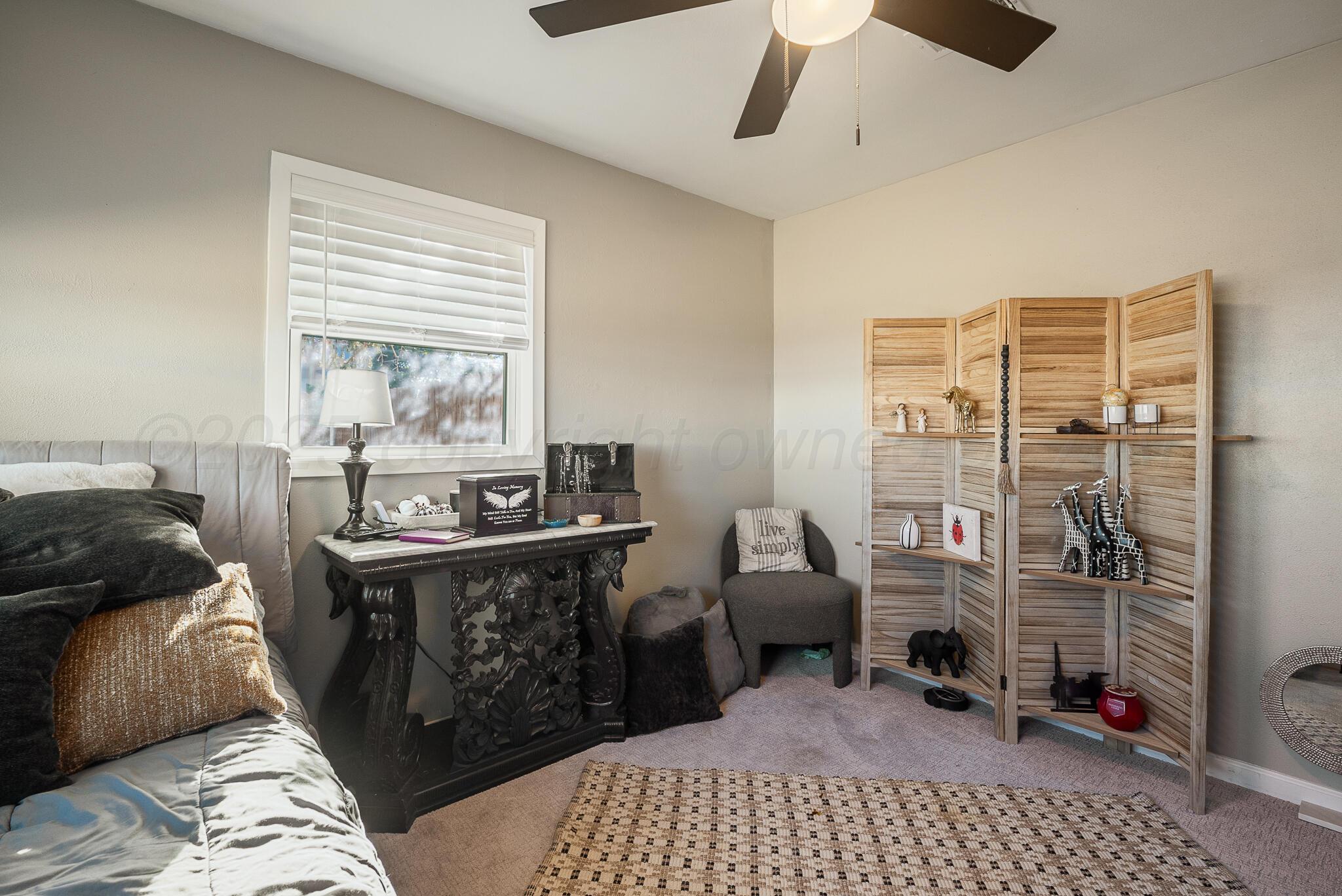 2220 Southeast 19th Avenue Amarillo, TX 79103 - Photo 19 of 25 a bed room with a bed and a window
