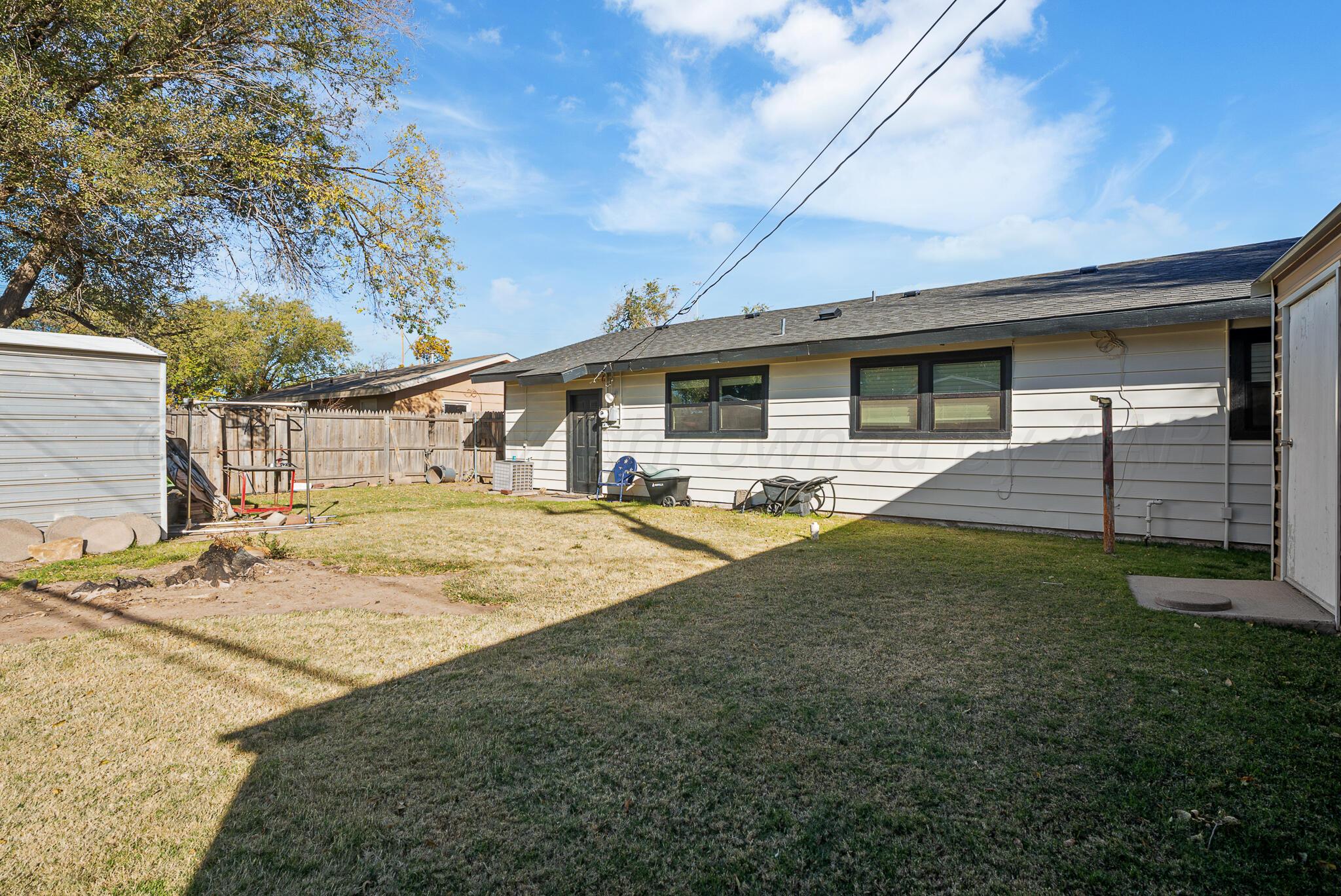 2220 Southeast 19th Avenue Amarillo, TX 79103 - Photo 24 of 25 a front view of house with yard and seating area