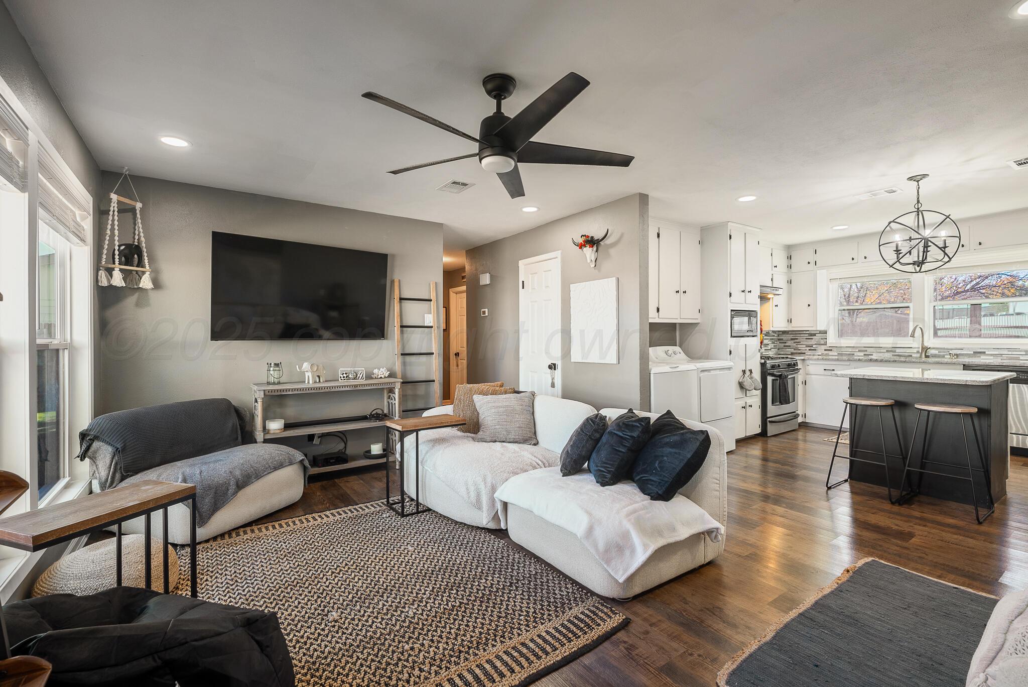 2220 Southeast 19th Avenue Amarillo, TX 79103 - Photo 5 of 25 a living room with furniture and a flat screen tv