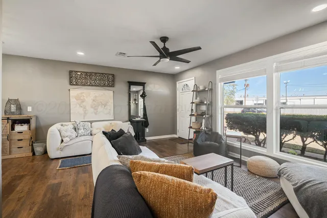 a living room with furniture and a large window