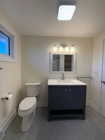 a bathroom with a sink and mirror
