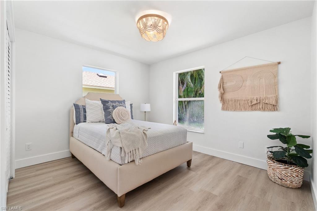 548 Ibis Way Naples, FL 34110 - Photo 24 of 45 a bedroom with a bed and a window