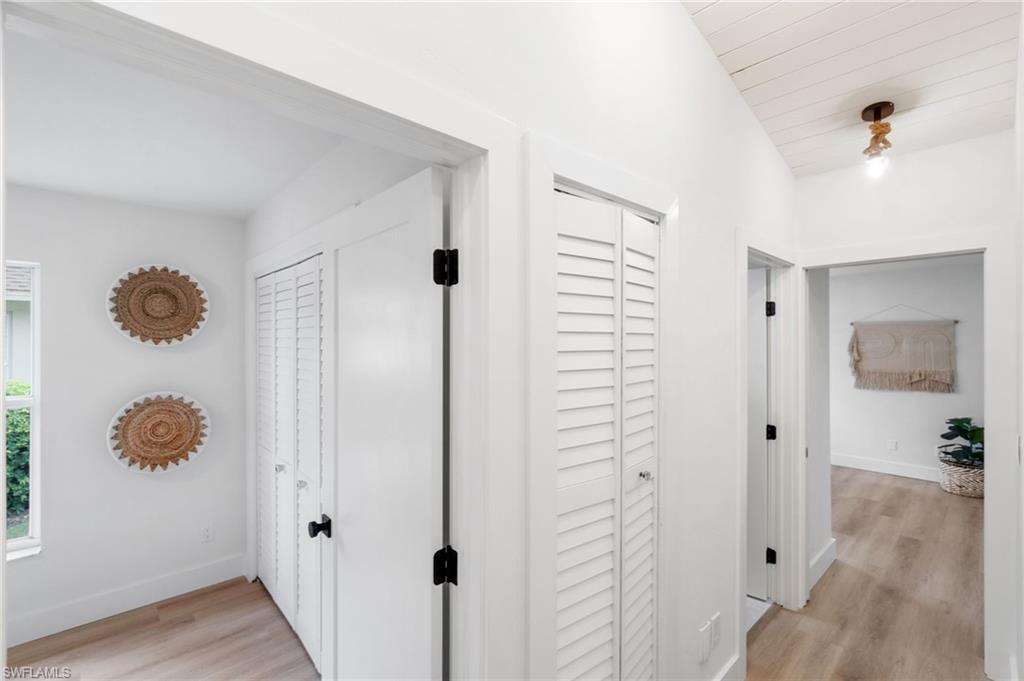 548 Ibis Way Naples, FL 34110 - Photo 28 of 45 a view of a room that has a shower curtain and a mirror