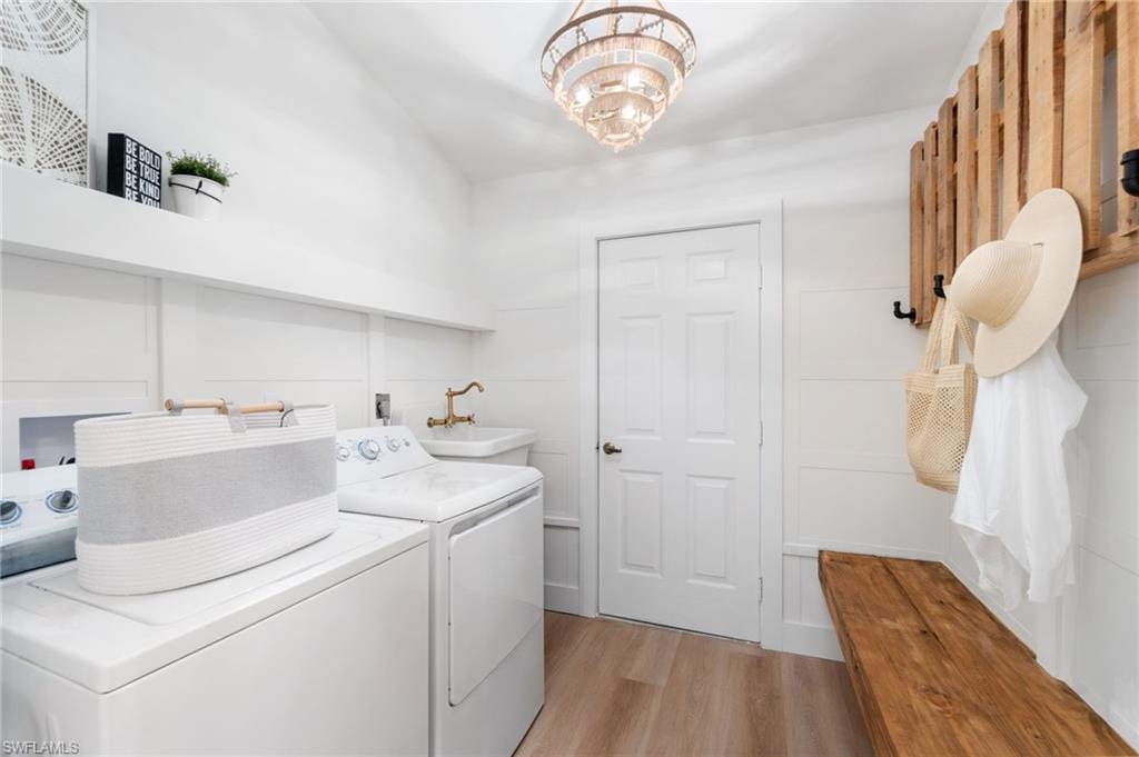 548 Ibis Way Naples, FL 34110 - Photo 32 of 45 a view of storage and utility room with washer and dryer