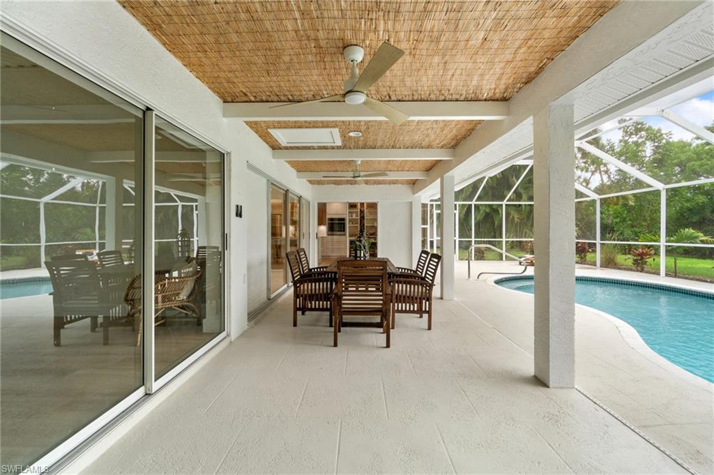 548 Ibis Way Naples, FL 34110 - Photo 38 of 45 a view of a chairs and table in a patio