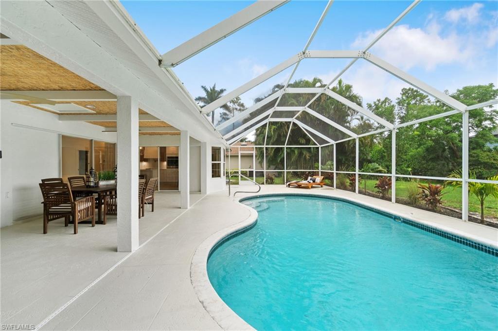 548 Ibis Way Naples, FL 34110 - Photo 40 of 45 a view of a living room with balcony