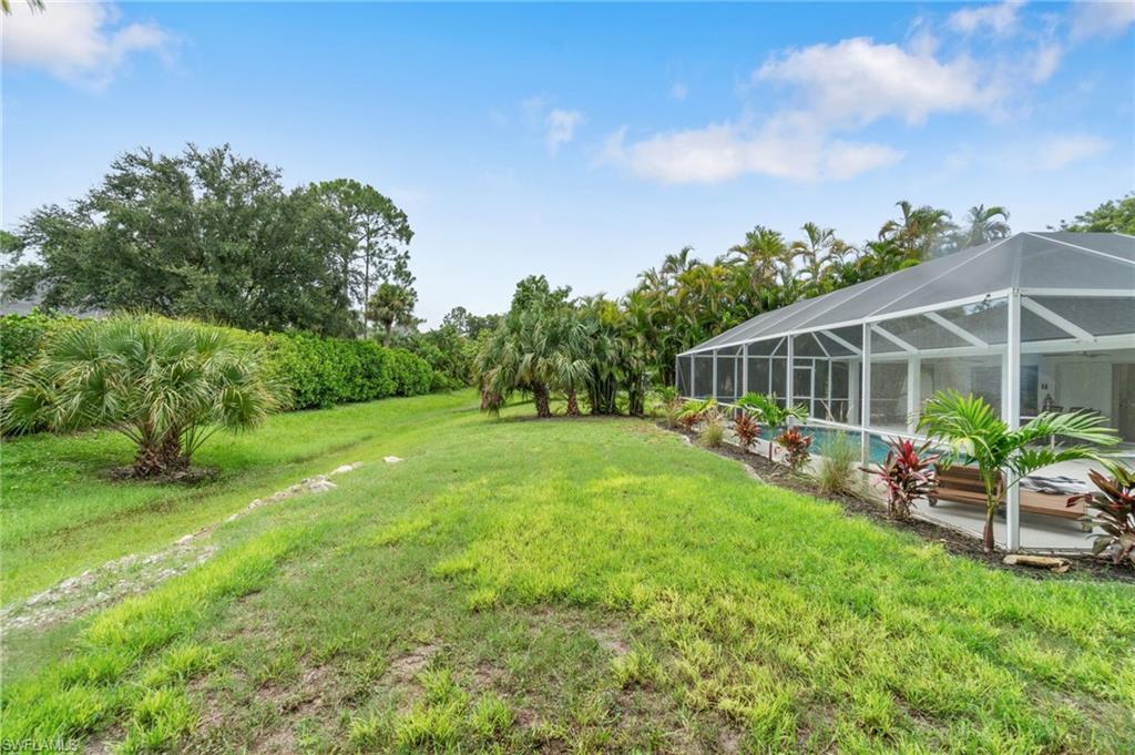 548 Ibis Way Naples, FL 34110 - Photo 42 of 45 a view of a house with backyard and sitting area