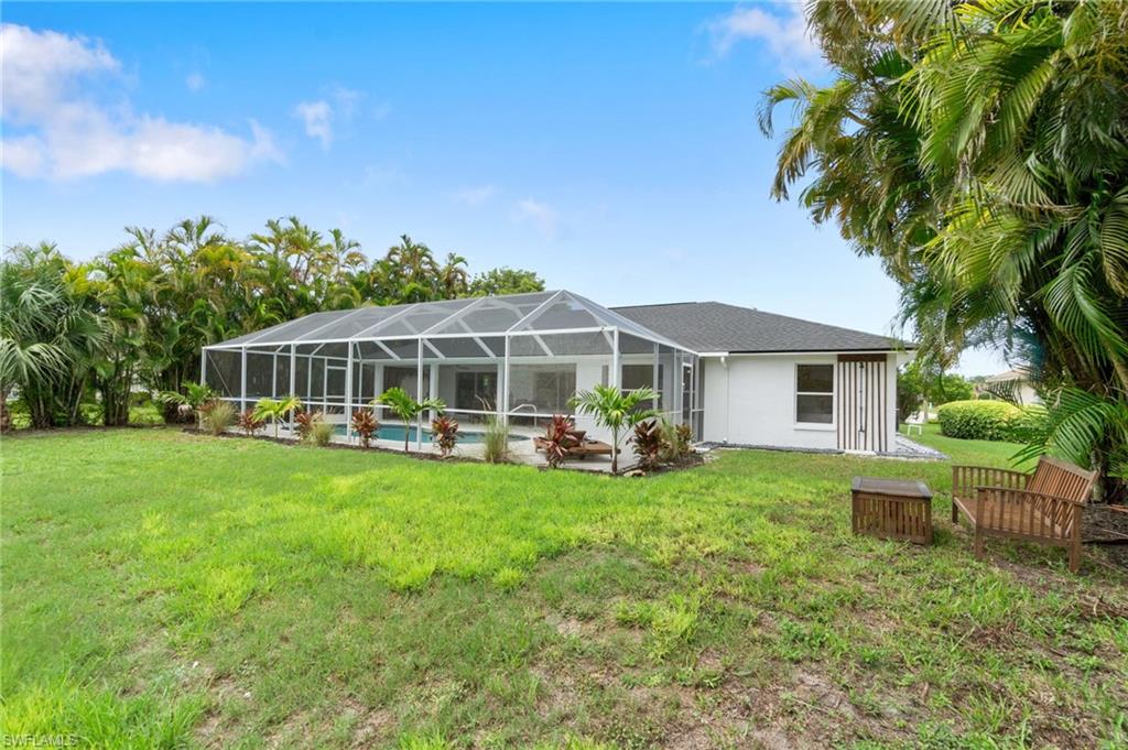 548 Ibis Way Naples, FL 34110 - Photo 43 of 45 a view of a house with backyard sitting area and garden