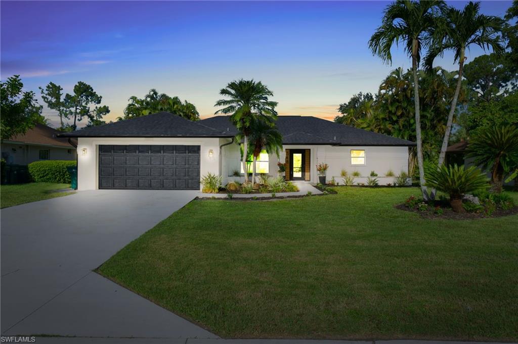 548 Ibis Way Naples, FL 34110 - Photo 45 of 45 a front view of a house with garden