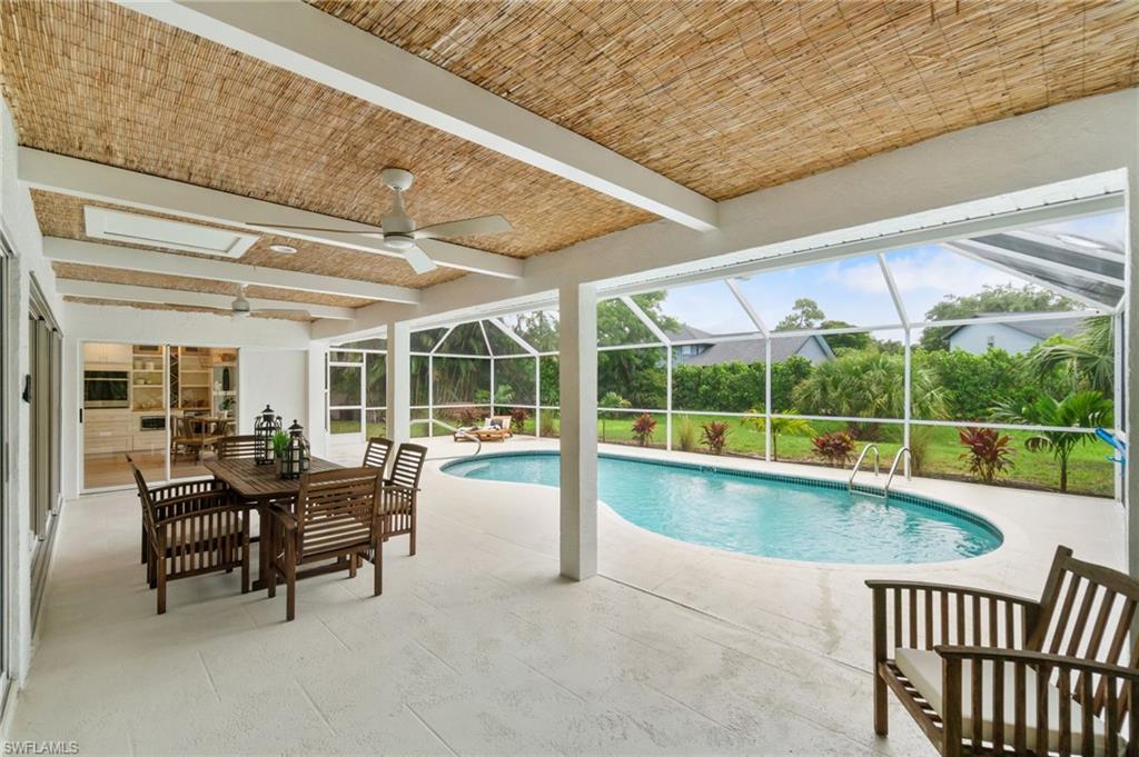548 Ibis Way Naples, FL 34110 - Photo 5 of 45 a view of a chairs and table in the roof deck