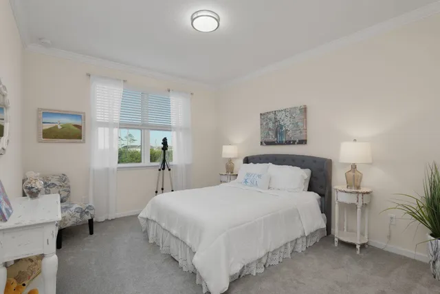 an aerial view of a house with a garden and lake view