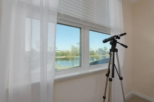 an aerial view of a house with a ocean view