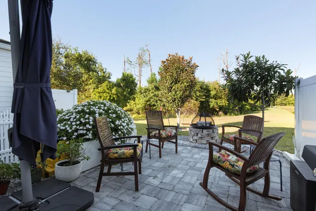 a picture of a bench in front of a wall