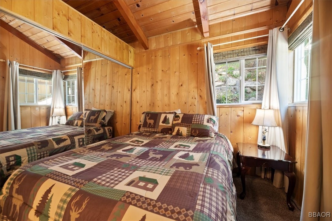 24755 Basel Drive Crestline, CA 92325 - Photo 13 of 28 a bed sitting in a bedroom next to a window