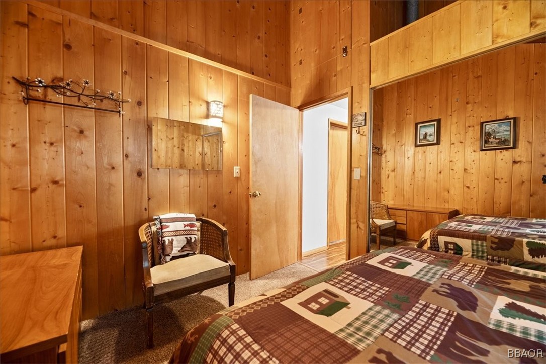 24755 Basel Drive Crestline, CA 92325 - Photo 14 of 28 a bedroom with a bed and a table chair