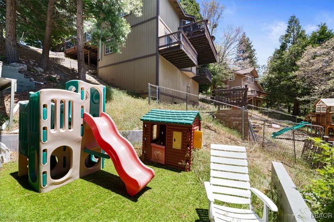24755 Basel Drive Crestline, CA 92325 - Photo 24 of 28 a backyard of a house with seating space