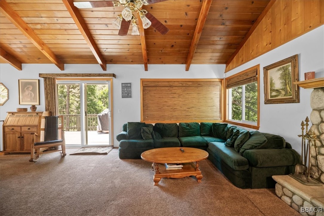 24755 Basel Drive Crestline, CA 92325 - Photo 3 of 28 a living room with furniture a ceiling fan and a large window