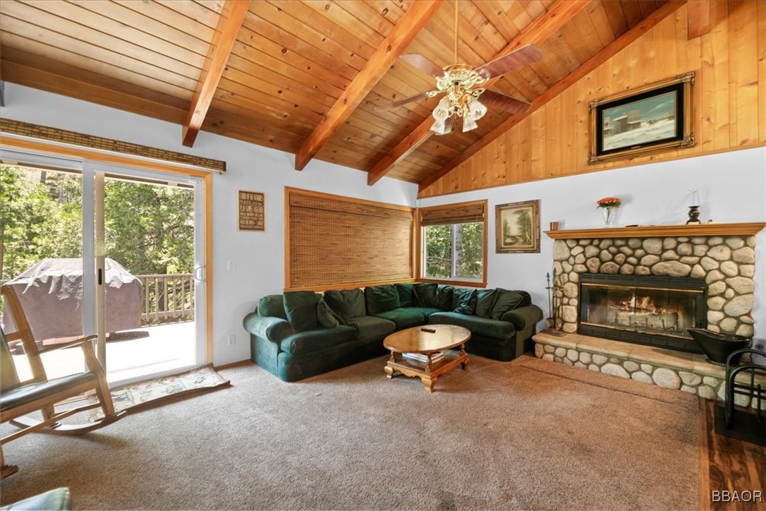 24755 Basel Drive Crestline, CA 92325 - Photo 4 of 28 a living room with furniture a fireplace and a flat screen tv