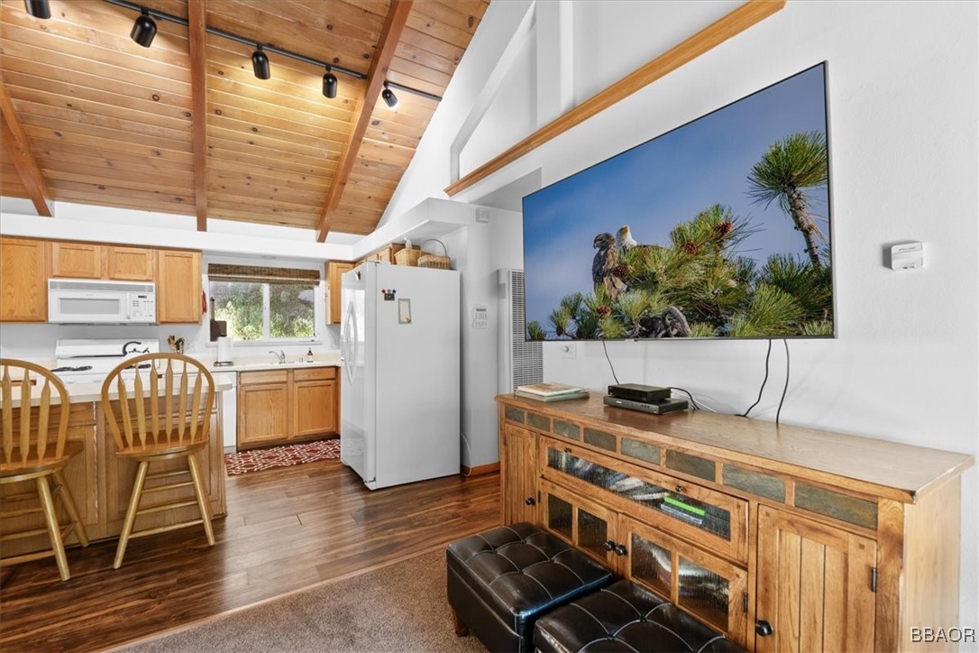 24755 Basel Drive Crestline, CA 92325 - Photo 7 of 28 a kitchen with stainless steel appliances kitchen island granite countertop a stove and a refrigerator
