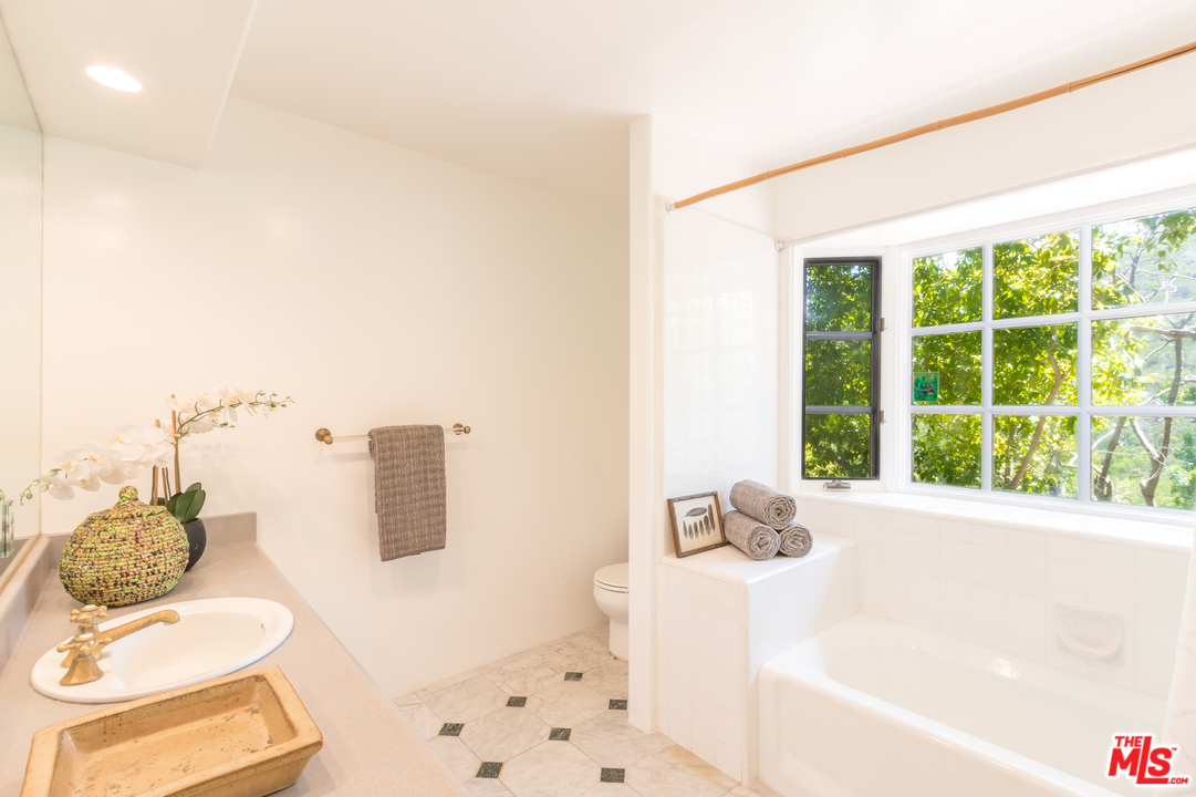 2382 Live Oak Meadows Road Malibu, CA 90265 - Photo 15 of 27 a bathroom with a bathtub sink and toilet