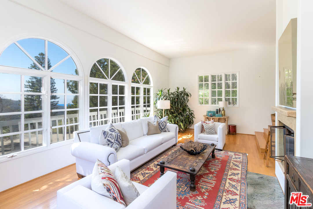 2382 Live Oak Meadows Road Malibu, CA 90265 - Photo 3 of 27 a living room with furniture and a large window
