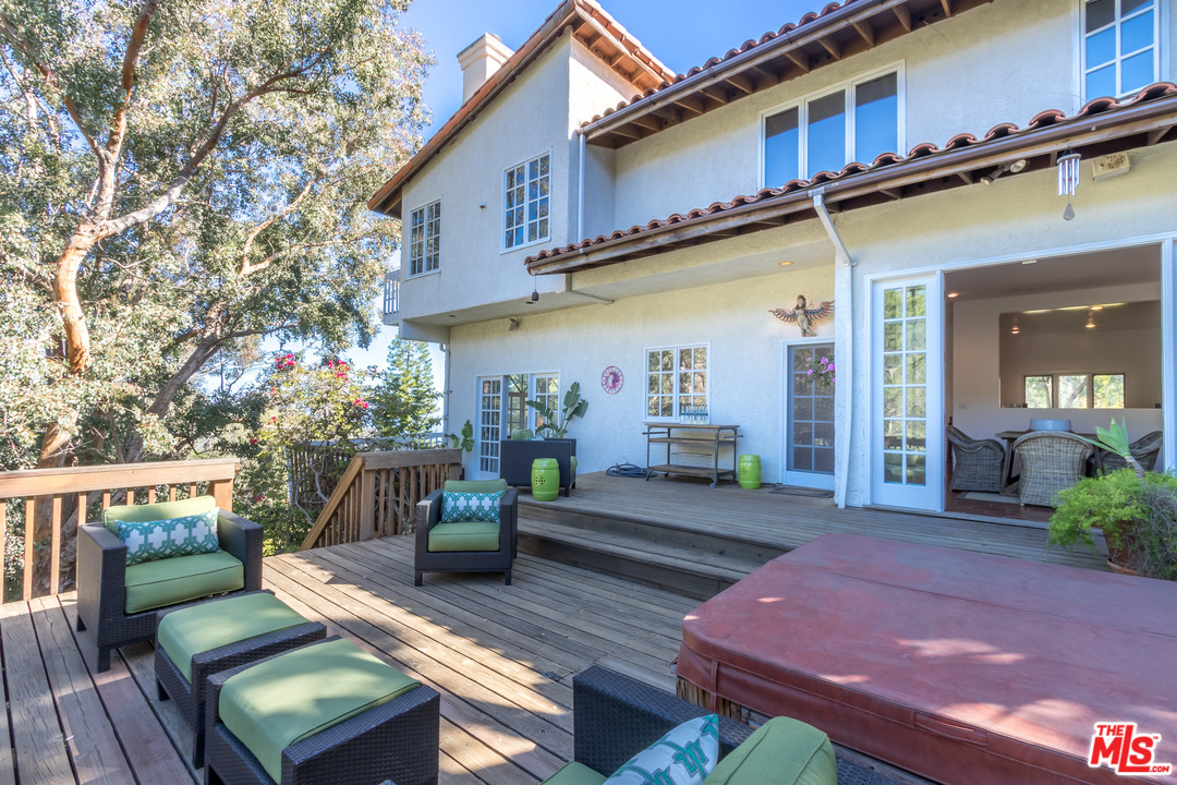 2382 Live Oak Meadows Road Malibu, CA 90265 - Photo 23 of 27 a view of a chairs and table in the patio