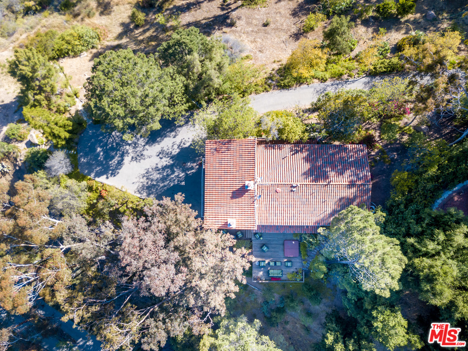 2382 Live Oak Meadows Road Malibu, CA 90265 - Photo 25 of 27 a view of a house with a yard