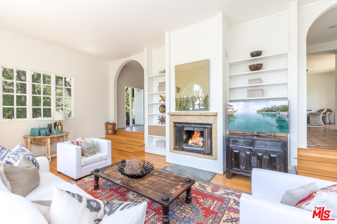2382 Live Oak Meadows Road Malibu, CA 90265 - Photo 4 of 27 a living room with furniture and a fireplace