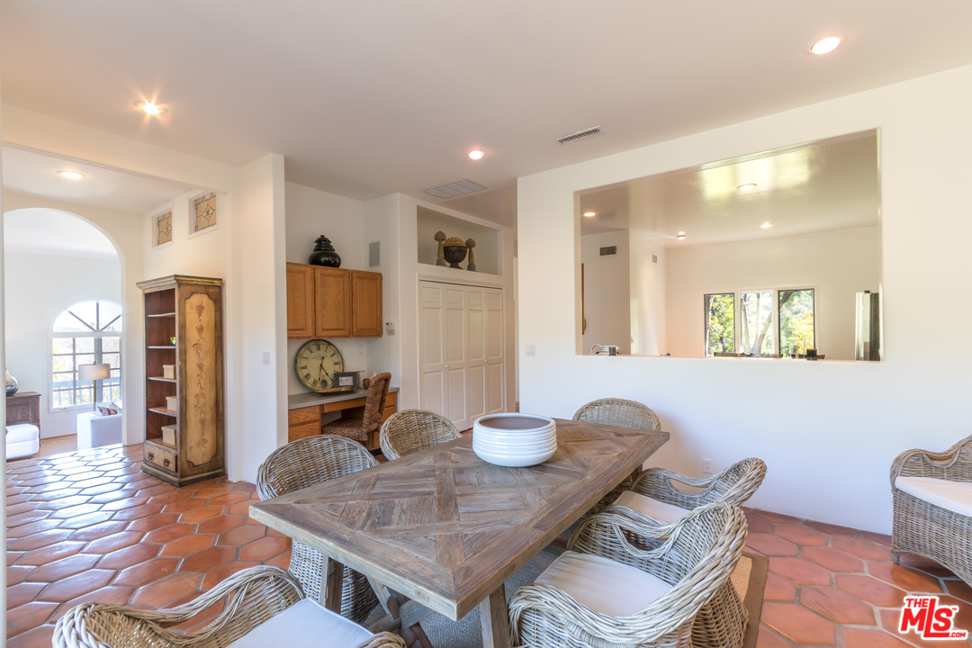 2382 Live Oak Meadows Road Malibu, CA 90265 - Photo 7 of 27 a dining room with furniture and wooden floor