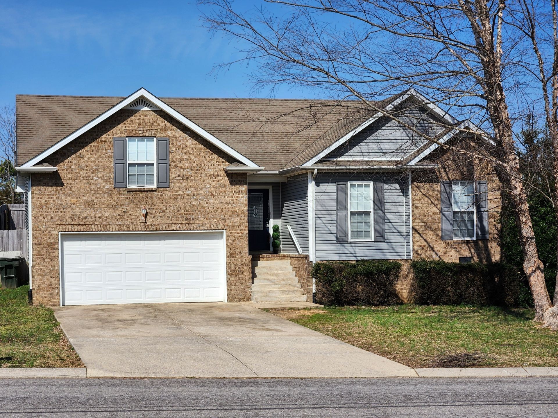 419 Berry Circle Springfield, TN 37172 - Photo 2 of 19 a front view of a house with a yard and garage