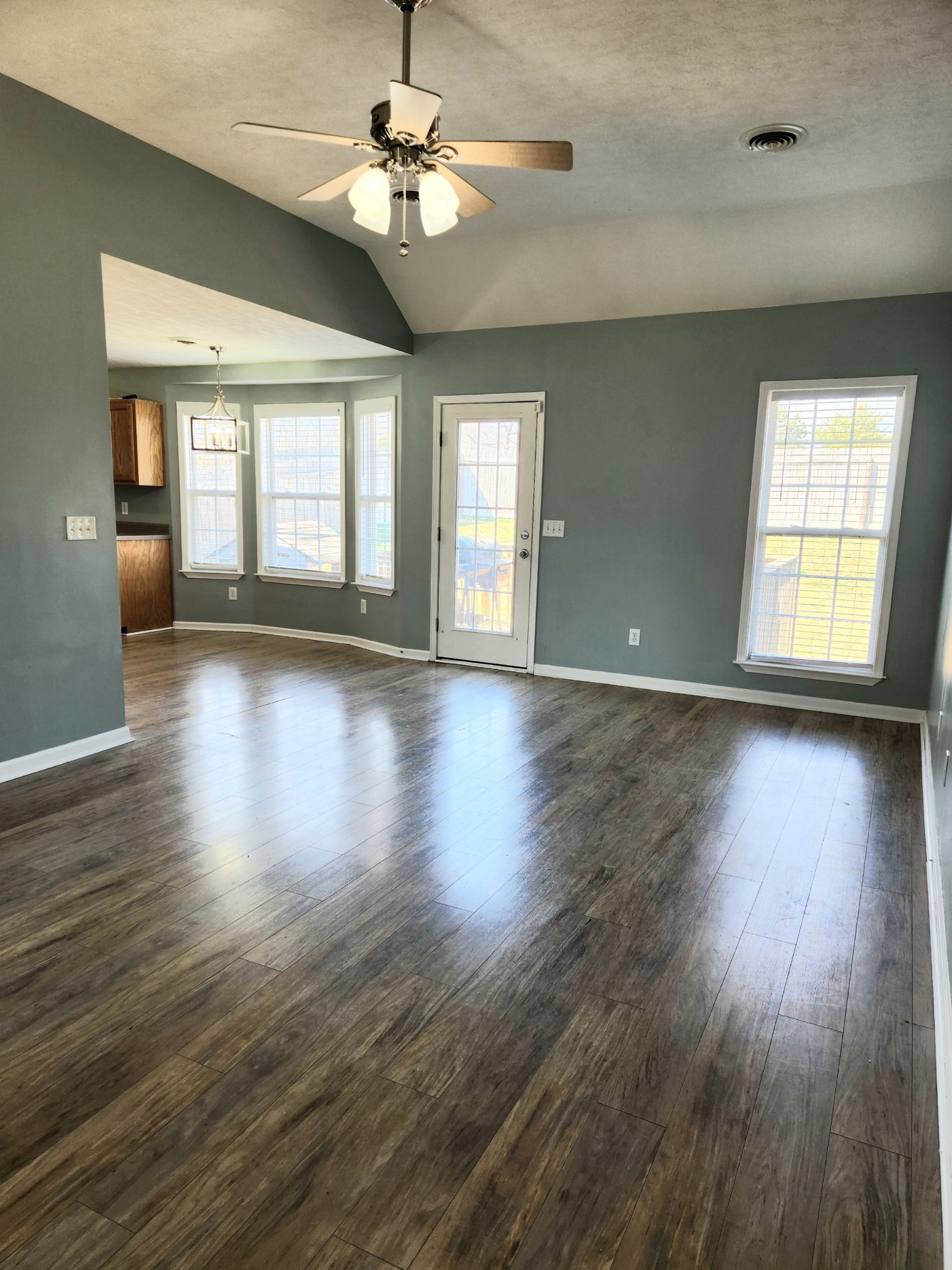 419 Berry Circle Springfield, TN 37172 - Photo 4 of 19 a view of an empty room with wooden floor and a window