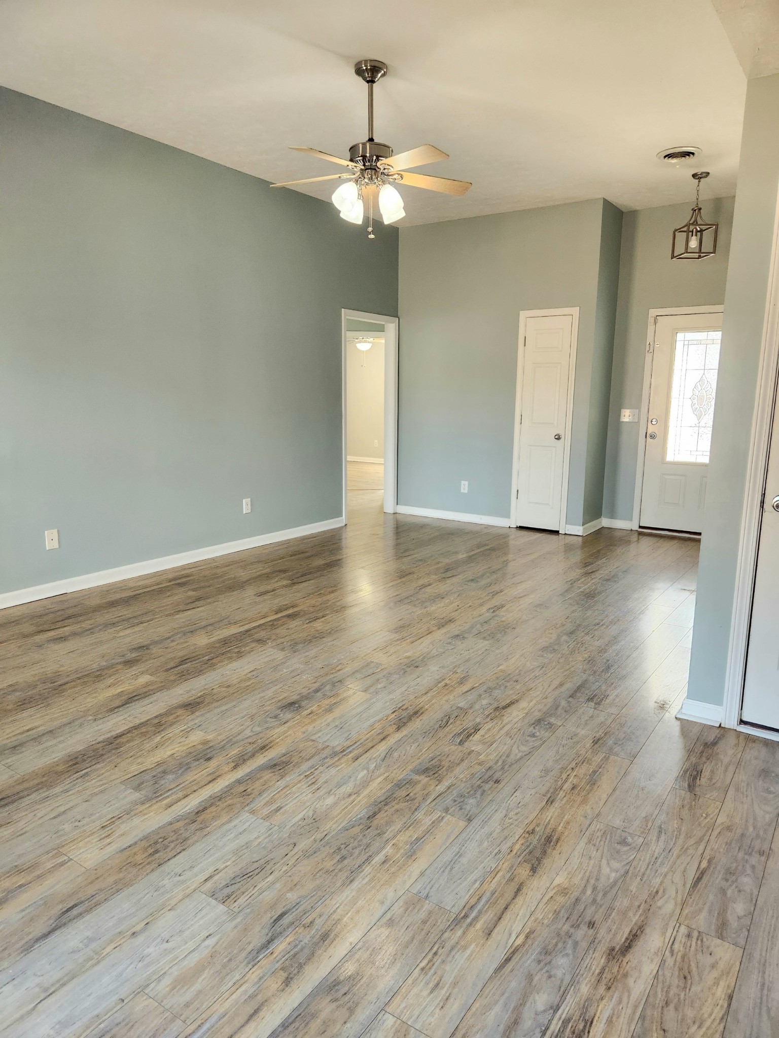 419 Berry Circle Springfield, TN 37172 - Photo 8 of 19 a view of an empty room with wooden floor and a window