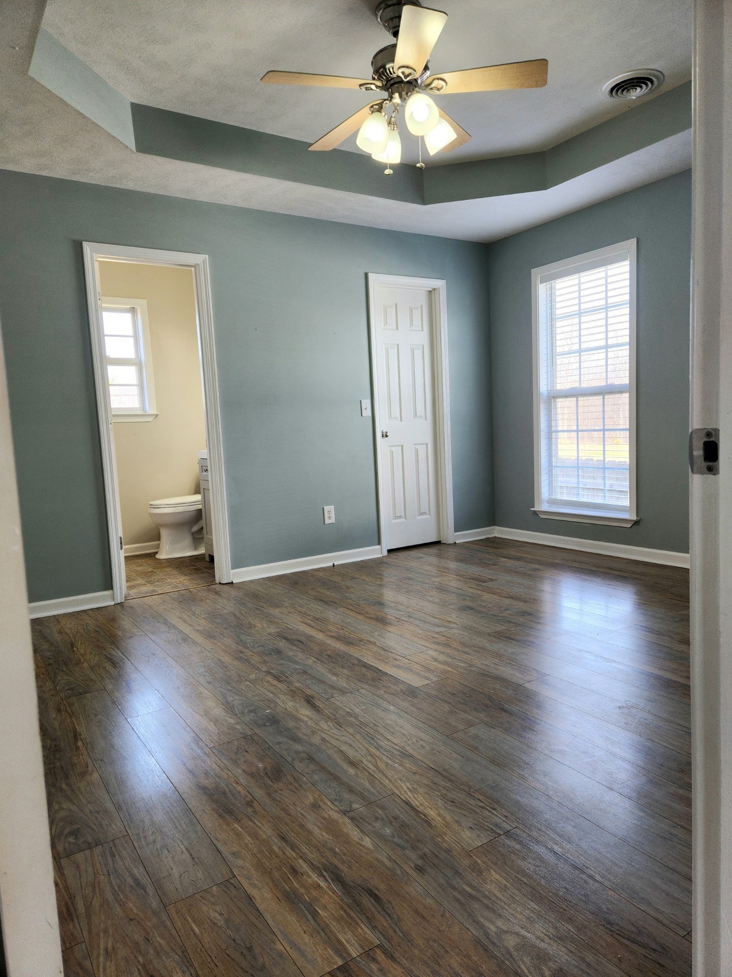 419 Berry Circle Springfield, TN 37172 - Photo 10 of 19 a view of an empty room with wooden floor and a window
