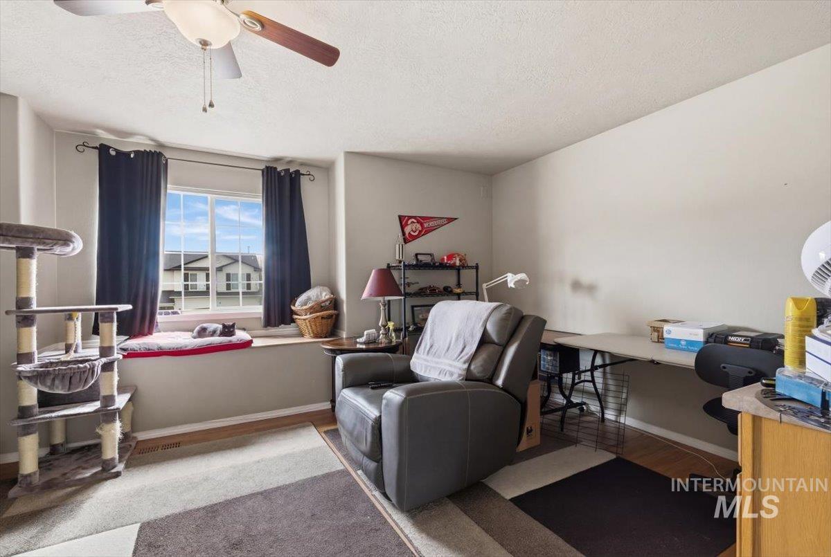 1896 West Ridge Pointe Avenue Nampa, ID 83651 - Photo 27 of 49 Office area with a ceiling fan, wood finished floors, and a textured ceiling